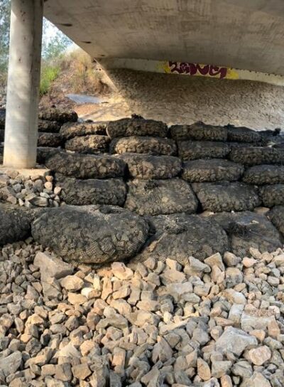 bridge column scour protection system. rock bags, gabion basket, riprap, rock armour